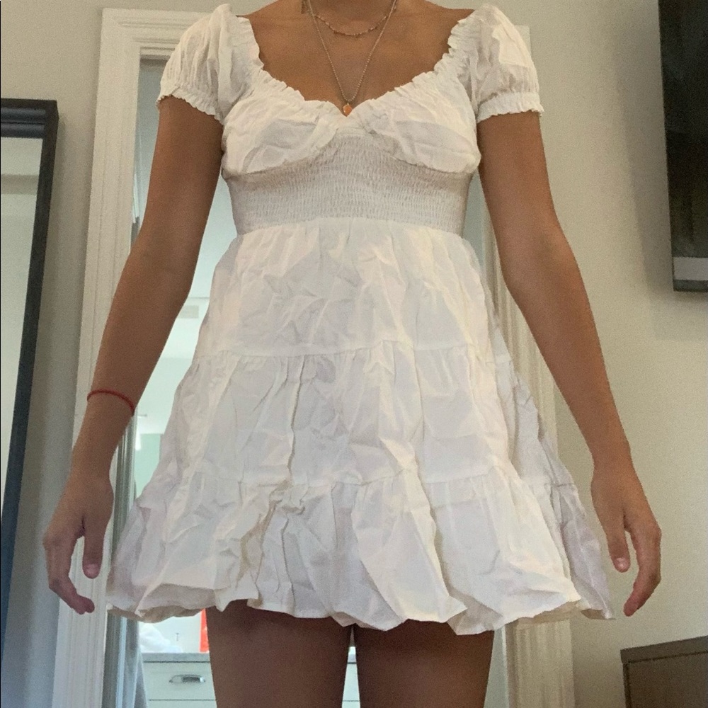 This is a fluffy white princess Polly dress. NWT